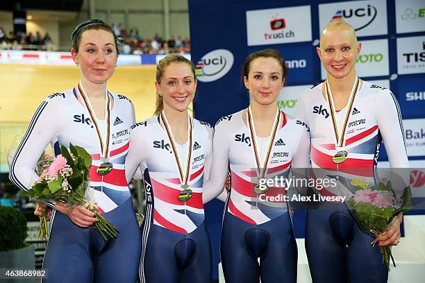 The Great Britain team of Katie Archibald, Laura Trott, Elinor Barker and Joanna Rowsell celebrate with the silver medals won in the Women's Team...