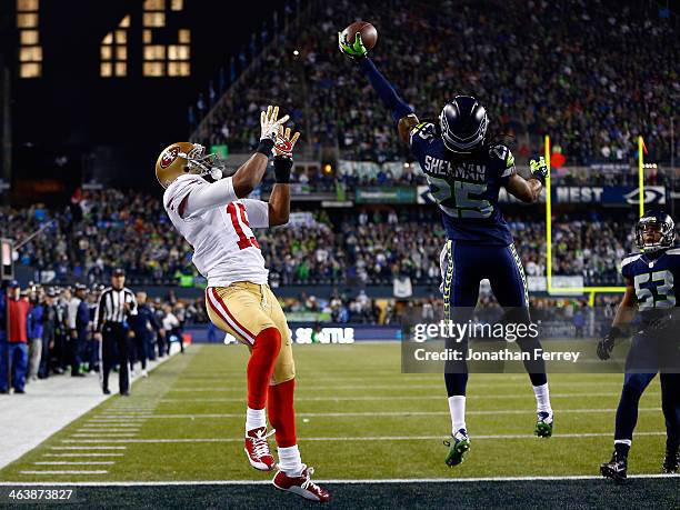 Cornerback Richard Sherman of the Seattle Seahawks tips the ball up in the air as outside linebacker Malcolm Smith catches it to clinch the victory...