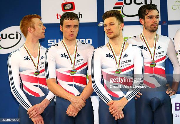 Ed Clancy, Steven Burke, Owain Doull and Andrew Tennant of the Great Britain Cycling Team look on after receiving their silver medals after the Men's...