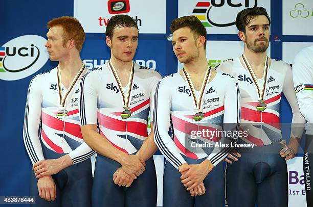 Ed Clancy, Steven Burke, Owain Doull and Andrew Tennant of the Great Britain Cycling Team look on after receiving their silver medals after the Men's...