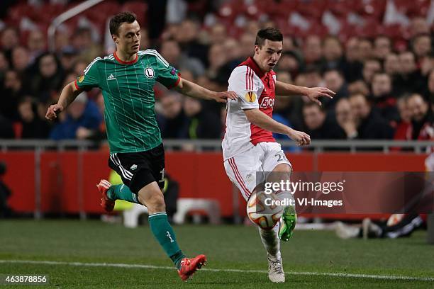 Michal Maslowski of Legia Warszawa, Nick Viergever of Ajax during the round of 32 UEFA Europa League match between Ajax and Legia Warsaw on February...