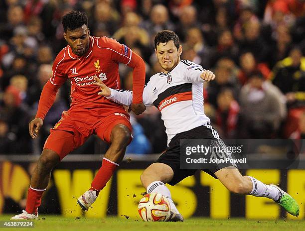 Daniel Sturridge of Liverpool competes with Pedro Franco of Besiktas during the UEFA Europa League Round of 32 match between Liverpool FC and...