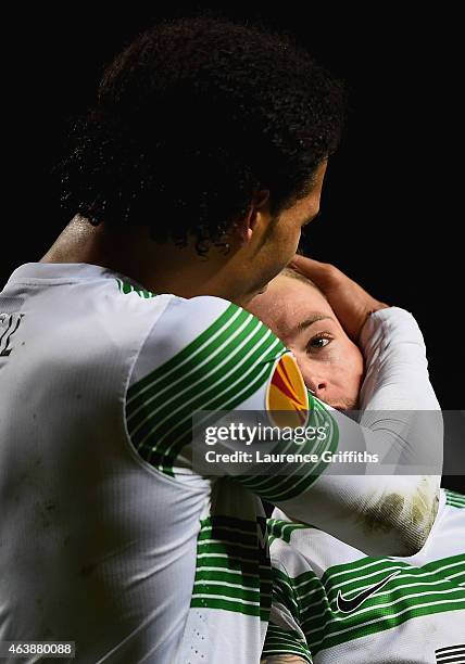 John Guidetti of Celtic is congratulated by Virgil van Dijk as he scores their third and equalising goal during the UEFA Europa League Round of 32...