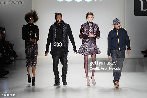 Designer Emilio Sosa walks the runway with a model in a design by Esosa at the New York Life fashion show during Mercedes-Benz Fashion Week Fall 2015...