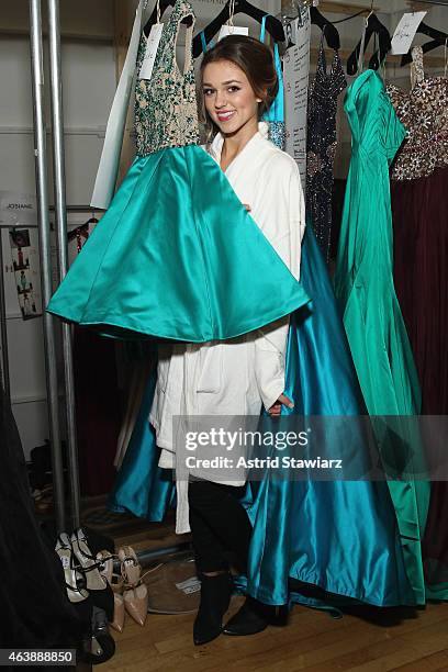 Sadie Robertson prepares backstage at the Sherri Hill fashion show during Mercedes-Benz Fashion Week Fall 2015 at The Plaza on February 19, 2015 in...