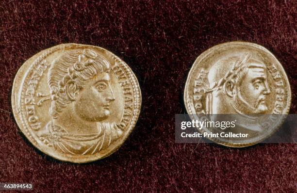 Gold coins showing heads of Roman Emperors Constantine the Great and Diocletian, 4th century. Constantine became emperor in 306. He rebuilt of the...