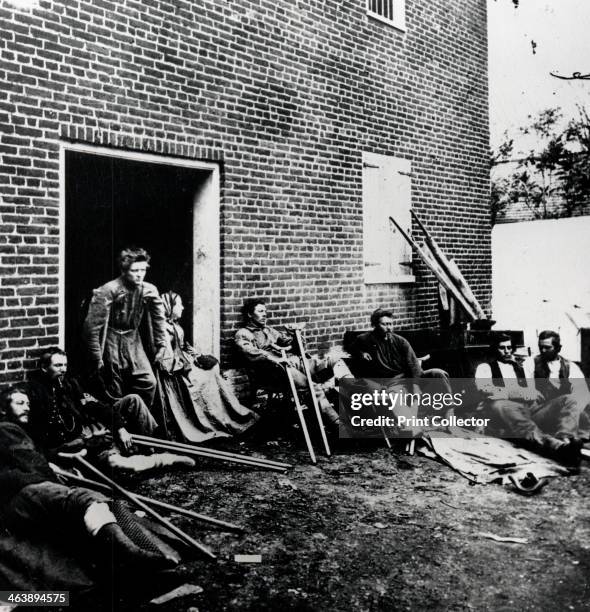 Casualties of the American Civil War, 1861-1865. Wounded soldiers in the care of the Red Cross sitting out in the fresh air.