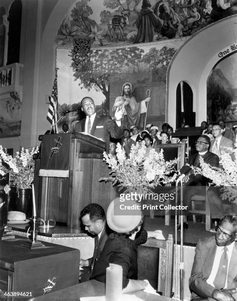 Martin Luther King Jnr , American black civil rights campaigner in the pulpit. Assassinated, supposedly by James Earl Ray.