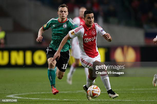 Michal Maslowski of Legia Warszawa, Anwar El Ghazi of Ajax during the round of 32 UEFA Europa League match between Ajax and Legia Warsaw on February...