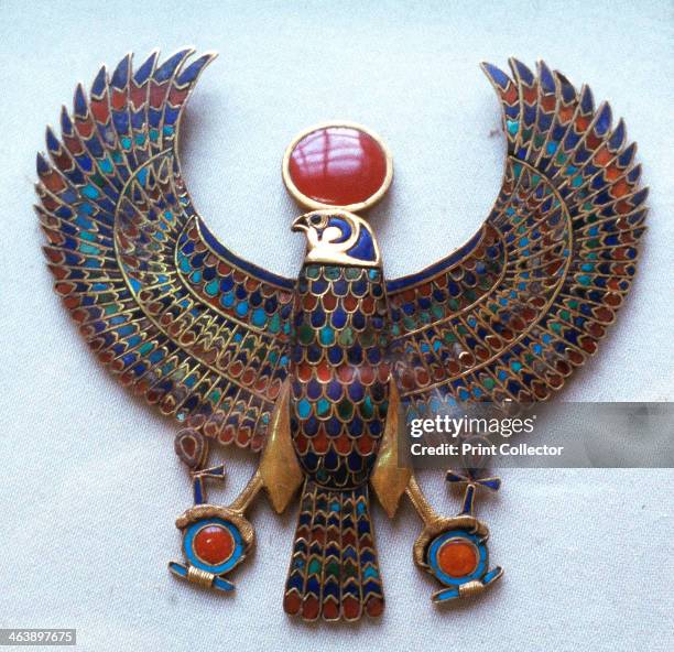 Pectoral jewel from the treasure of Tutankhamun, Ancient Egyptian, c1325 BC. A pectoral jewel showing Horus, the falcon-headed god, crowned with a...