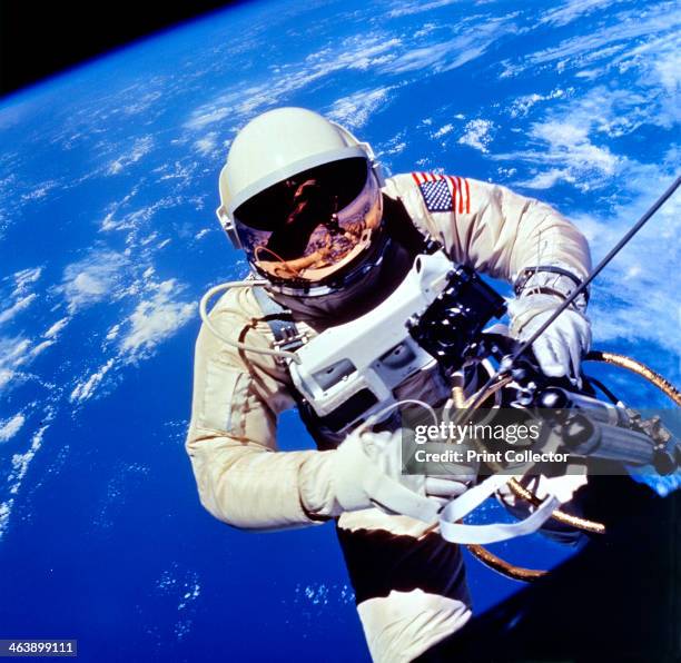 Astronaut Edward H. White II carrying out external tasks during third orbit of Gemini-Titan 4 flight. CREDIT: NASA.