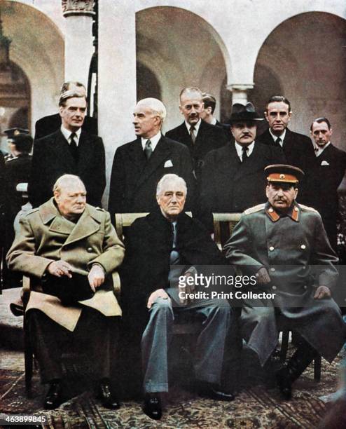 Yalta Conference of Allied leaders, World War II, 4-11 February 1945. Seated left to right: Churchill, Roosevelt and Stalin. Their respective foreign...
