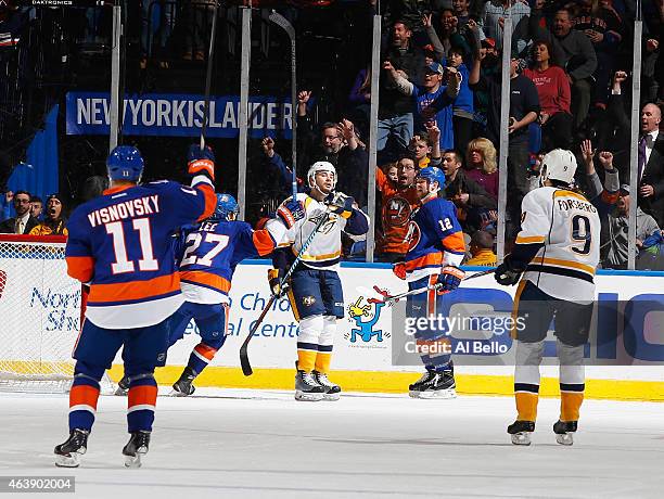 The New York Islanders celebrate a goal by New York Islanders left wing Josh Bailey against the Nashville Predators during their game at the Nassau...