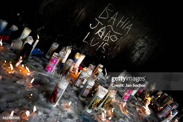 Votive candles to Omolú, the Candomblé spirit syncretized with Saint Lazarus, seen outside the St. Lazarus church on January 30, 2012 in Salvador,...