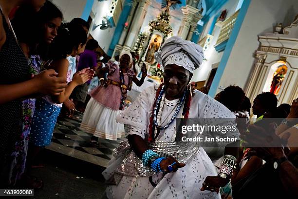 Baiana woman performs the ritual dance in honor to Omolú, the Candomblé spirit syncretized with Saint Lazarus, inside the St. Lazarus church on...