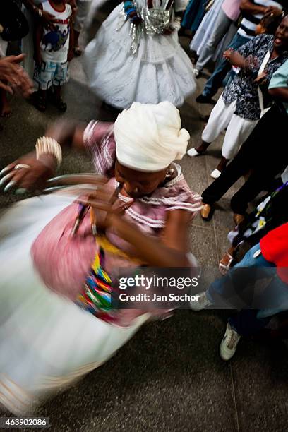 Baiana woman performs the ritual dance in honor to Omolú, the Candomblé spirit syncretized with Saint Lazarus, inside the St. Lazarus church on...