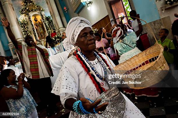 Baiana woman performs the ritual dance in honor to Omolú, the Candomblé spirit syncretized with Saint Lazarus, inside the St. Lazarus church on...