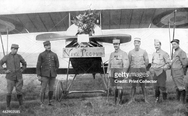 French air ace Adolphe Pegoud, 1914-1915. Pegoud, 4th from right, standing in front of his plane on the day when fellow officers presented him with a...