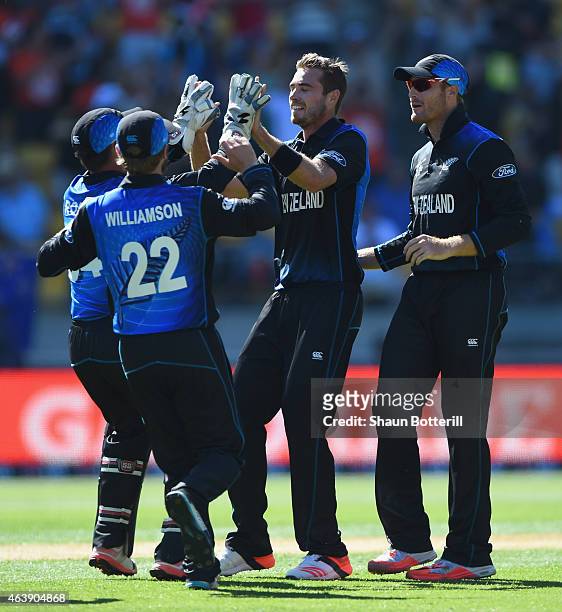 Tim Southee of New Zealand celebrates with team-mates after taking the wicket of Chris Woakes of England during the 2015 ICC Cricket World Cup match...