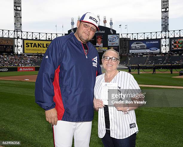 Mark Parent of the Chicago White Sox and breast cancer survivor and MLB Honorary Bat Girl Vanessa Parzatka pose for a photo prior delivering the...
