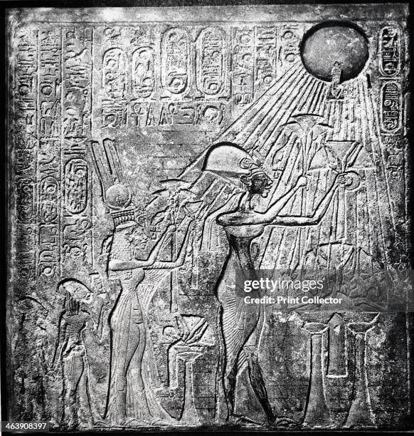 Akhenaten heretic Egyptian pharaoh. Relief originally in the Temple of the Sun, Thebes, showing Akhenaten with his wife Nefertiti and their two...