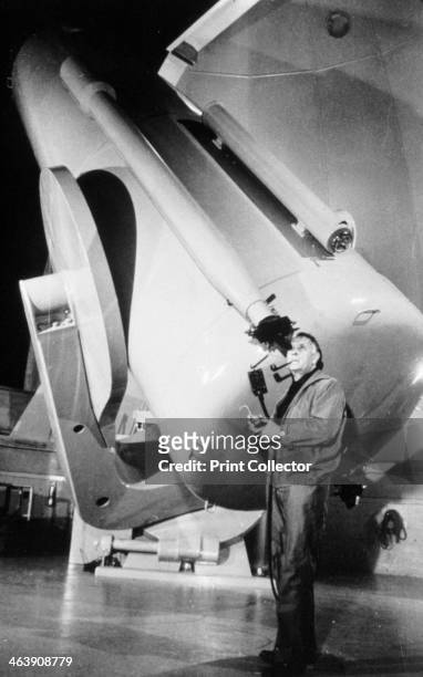 Edwin Powell Hubble , American astronomer, in the obsevatory. Using the powerful hooker 100 inch reflector at Mount Wilson Observatory, Powell was...