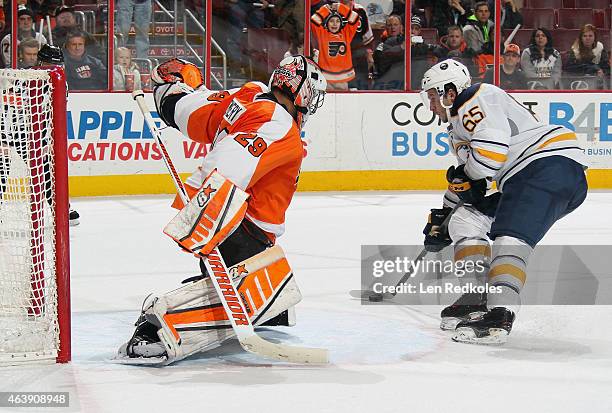 Brian Flynn of the Buffalo Sabres attempts a shot against Ray Emery of the Philadelphia Flyers in the shootout on February 19, 2015 at the Wells...
