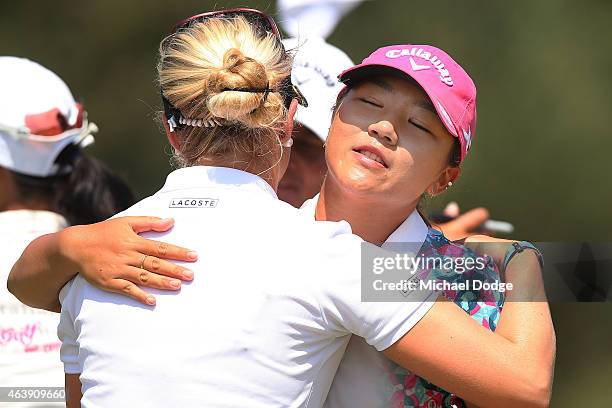 Lydia Ko of New Zealand and Charley Hull of England hug after finishing their round at the 18th hole during day one of the LPGA Australian Open at...
