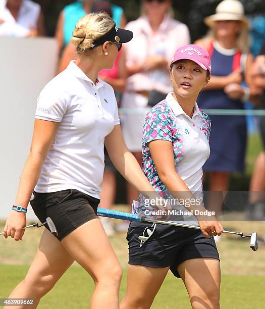 Lydia Ko of New Zealand and Charley Hull of England talk up the first hole during day one of the LPGA Australian Open at Royal Melbourne Golf Course...