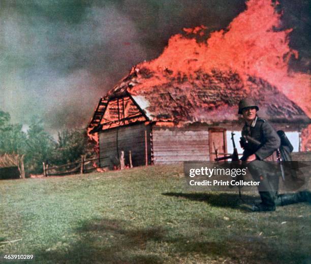 'Through the curtain of flame German observers move forward', Russia, 1941. A print from Signal, December 1941. Signal was a magazine published by...