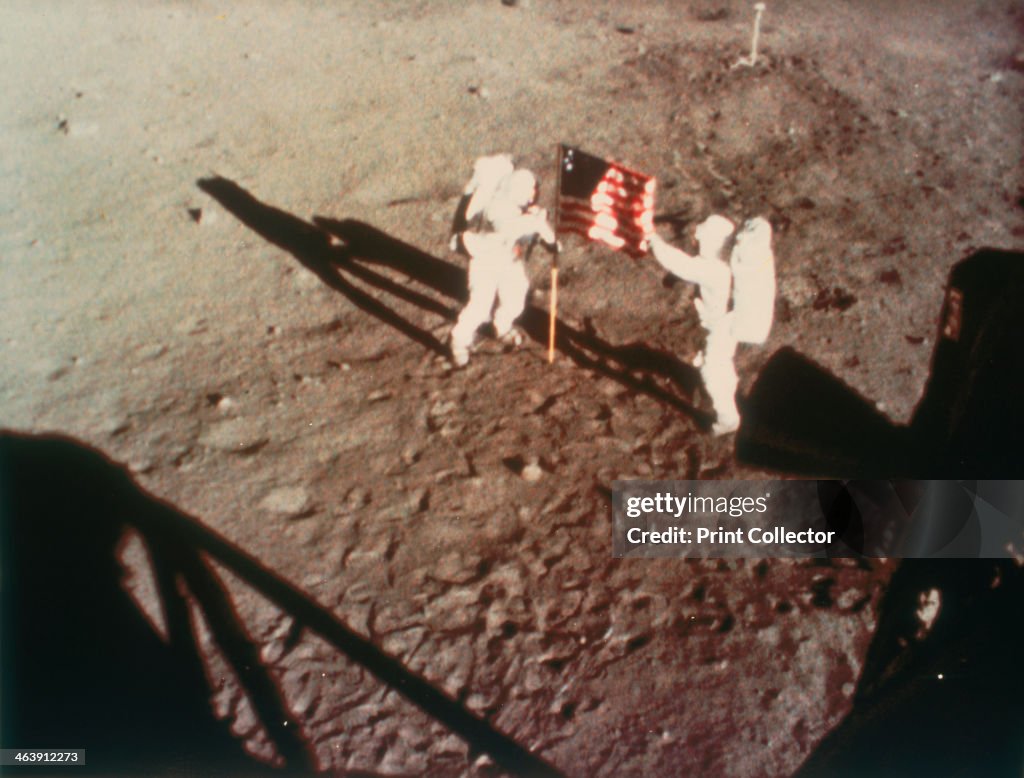 Armstrong and Aldrin unfurl the US flag on the moon, 1969.