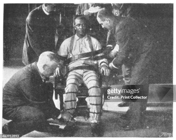 'Strapping the Victim into the Death Chair', United States, 1898. The operation takes only a couple of seconds to perform, each keeper being...