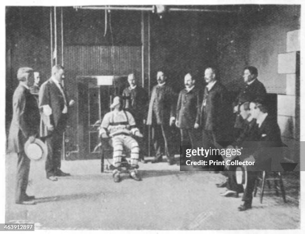 Execution by electric chair, United States, 1898. The warden holds a handkerchief in his left hand. The doctor holds his watch. The electrician...