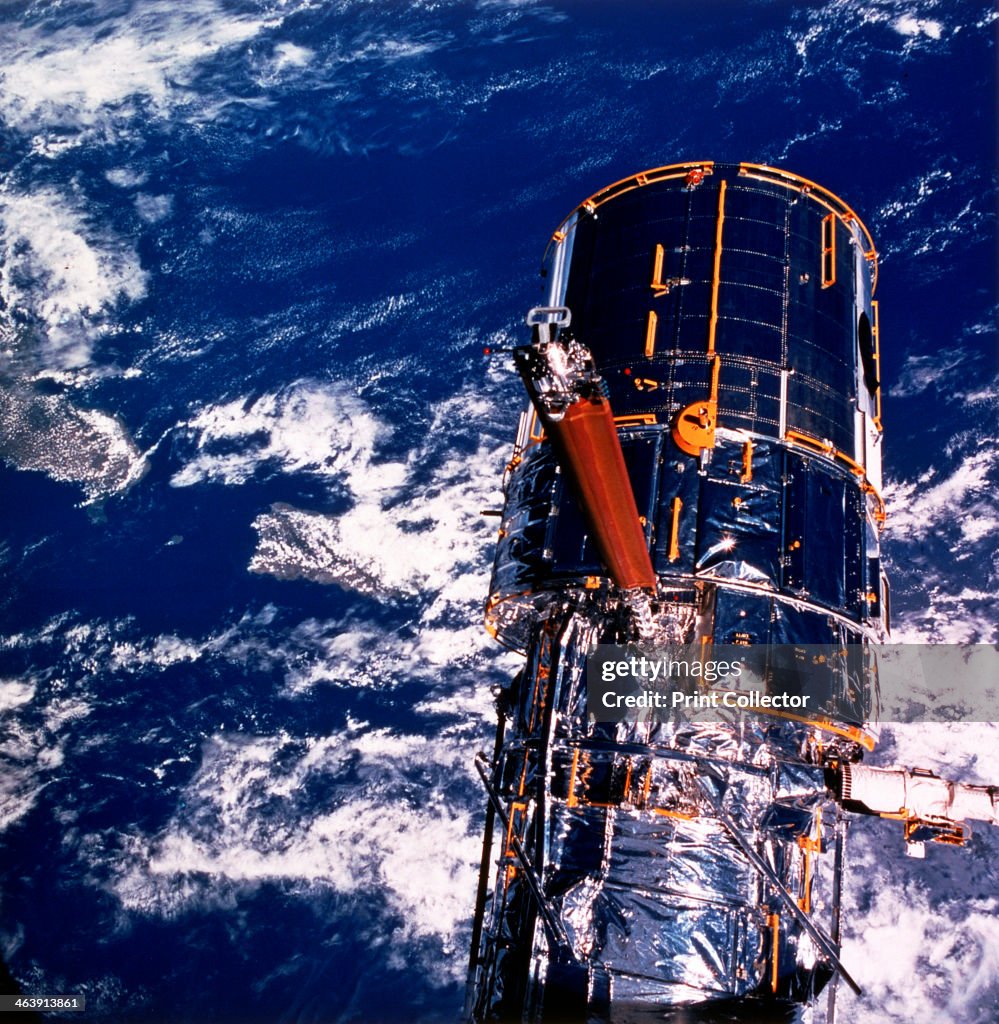 Hubble Space Telescope above the Earth.