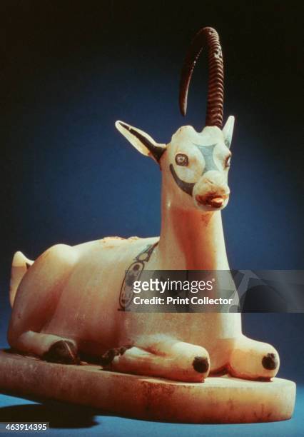 Lid of an unguent jar in the form of an ibex, from Tutankhamun's tomb, 14th century BC. Eyes inlaid with bronze and glass-pasteroyal cartouche. The...