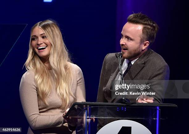 Honorees Lauren Parsekian and Aaron Paul accept the unite2gether Award onstage at the 2nd Annual unite4:humanity presented by ALCATEL ONETOUCH at the...