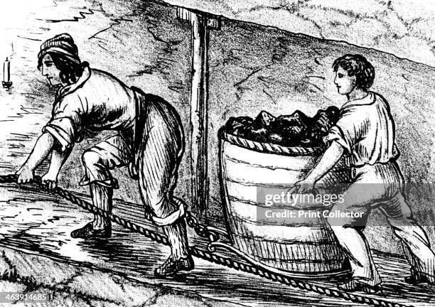 Woman and a boy working in a coal mine, Bolton, Lancashire, 1848. A woman and boy underground in a coal mine moving a basket containing 3-4 cwt of...