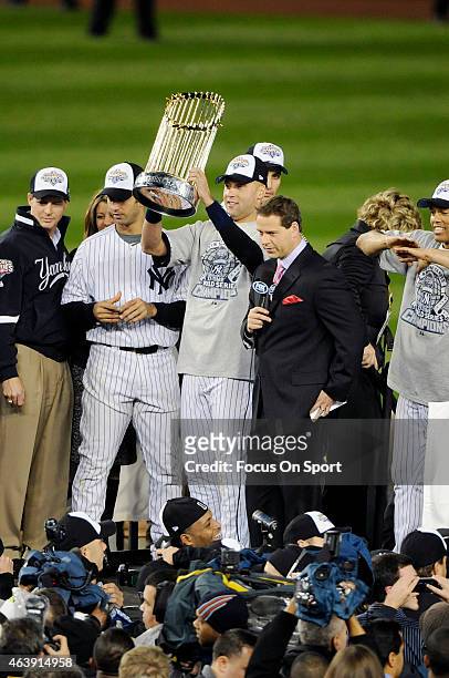 Derek Jeter of the New York Yankees holds the Commissioner's Trophy after the Yankees defeated the Philadelphia Phillies in Game Six of the 2009...