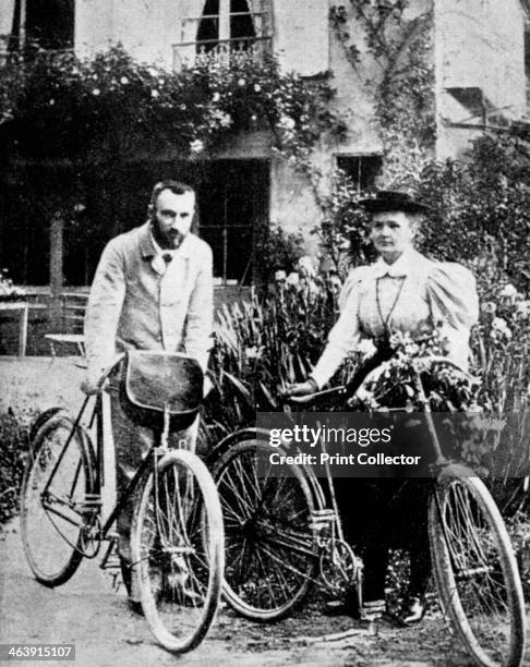 Pierre and Marie Curie, French physicists, preparing to go cycling. Polish-born Marie Curie and her husband Pierre continued the work on...