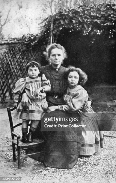 Marie Curie, Polish-born French physicist, with her daughters Eve and Irene, 1908. Marie Curie and her husband Pierre continued the work on...