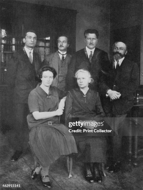 Marie Curie, Polish-born French physicist. Marie Curie with her daughter Irene Joliot-Curie and members of the Institute of Radium, Paris. On the...