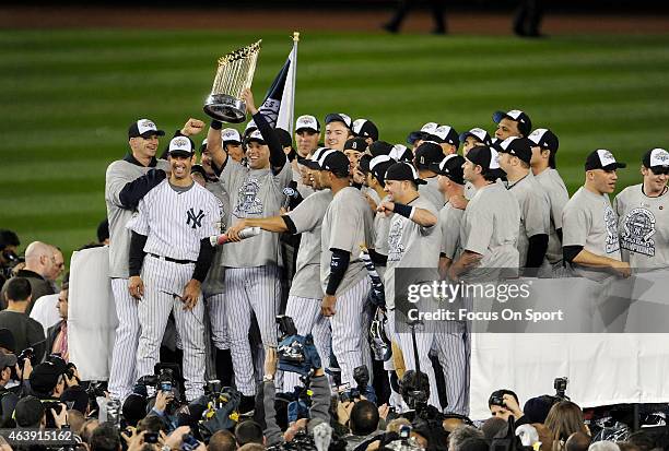 Derek Jeter of the New York Yankees holds the Commissioner's Trophy after the Yankees defeated the Philadelphia Phillies in Game Six of the 2009...