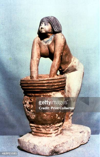 Woman brewing beer, Ancient Egyptian tomb model. From the Cairo Museum, Egypt.