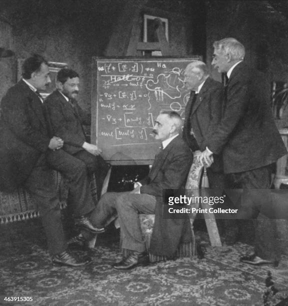 Albert Einstein and other physicists at Paul Ehrenfest's home, Leiden, Netherlands, circa 1915. Einstein with Paul Ehrenfest, Paul Langevin ,...