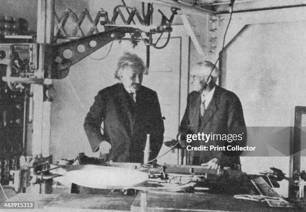 Albert Einstein at Mount Wilson Observatory, California, USA. Einstein examining the spectrograph at the base of the 150-foot tower telescope....