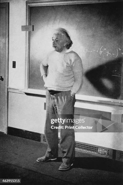 Albert Einstein, German-Swiss-American mathematician and physicist, 1940. Einstein in his study at Institute of Advanced Study, Princeton, New...