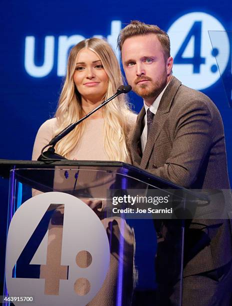 Actress/director Lauren Paul and actor Aaron Paul accept the unite2gether Award onstage at the 2nd Annual unite4:humanity presented by ALCATEL...