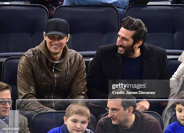Alexander Skarsgard and Fares Fares attend Vancouver Canucks vs New York Rangers game at Madison Square Garden on February 19, 2015 in New York City.