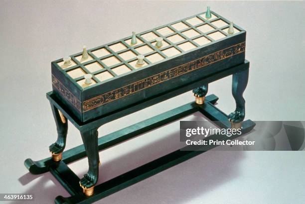 Senet gaming board, from Tutankhamun's tomb, 14th century BC. Made from wood veneered with ebony and inlaid with ivory. The tomb of the 18th Dynasty...