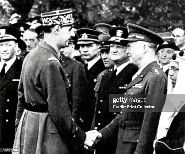 De Gaulle greets Eisenhower, 1944. General Charles de Gaulle shaking hands with General Dwight Eisenhower during a meeting with allied commanders in...